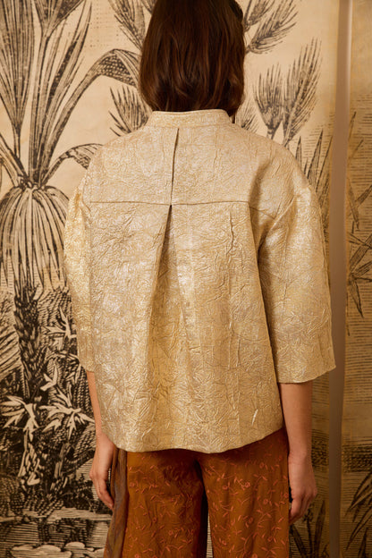 Cazadora metalizada dorada