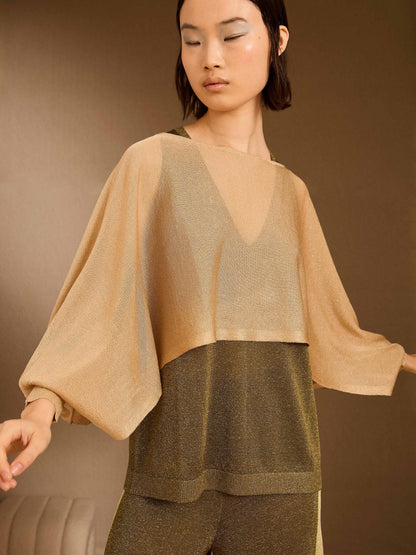 Poncho de lurex dorado