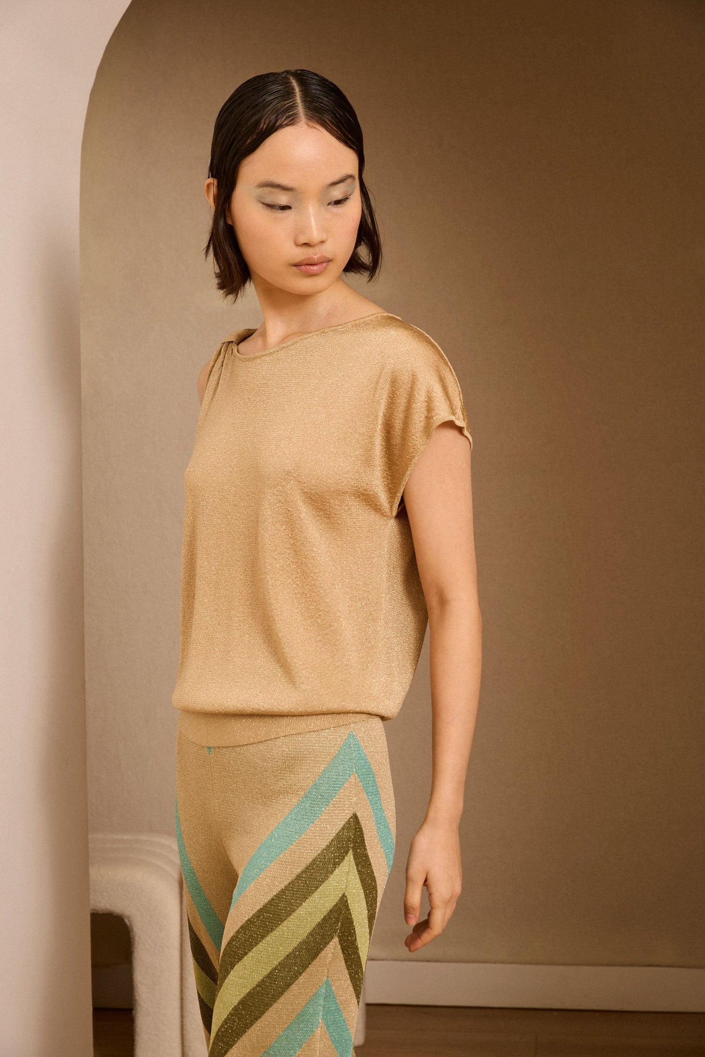 Jersey dorado de lurex asimétrico