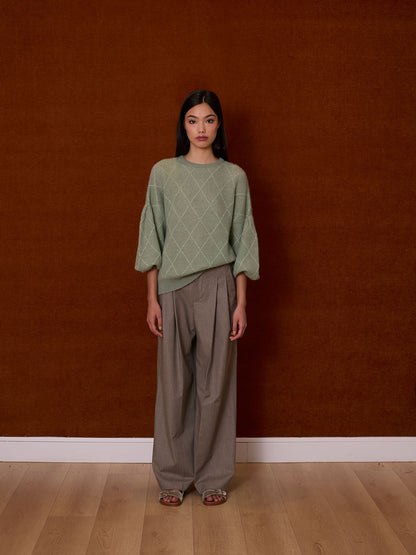 Jersey verde agua con rombos de lurex y mangas farol