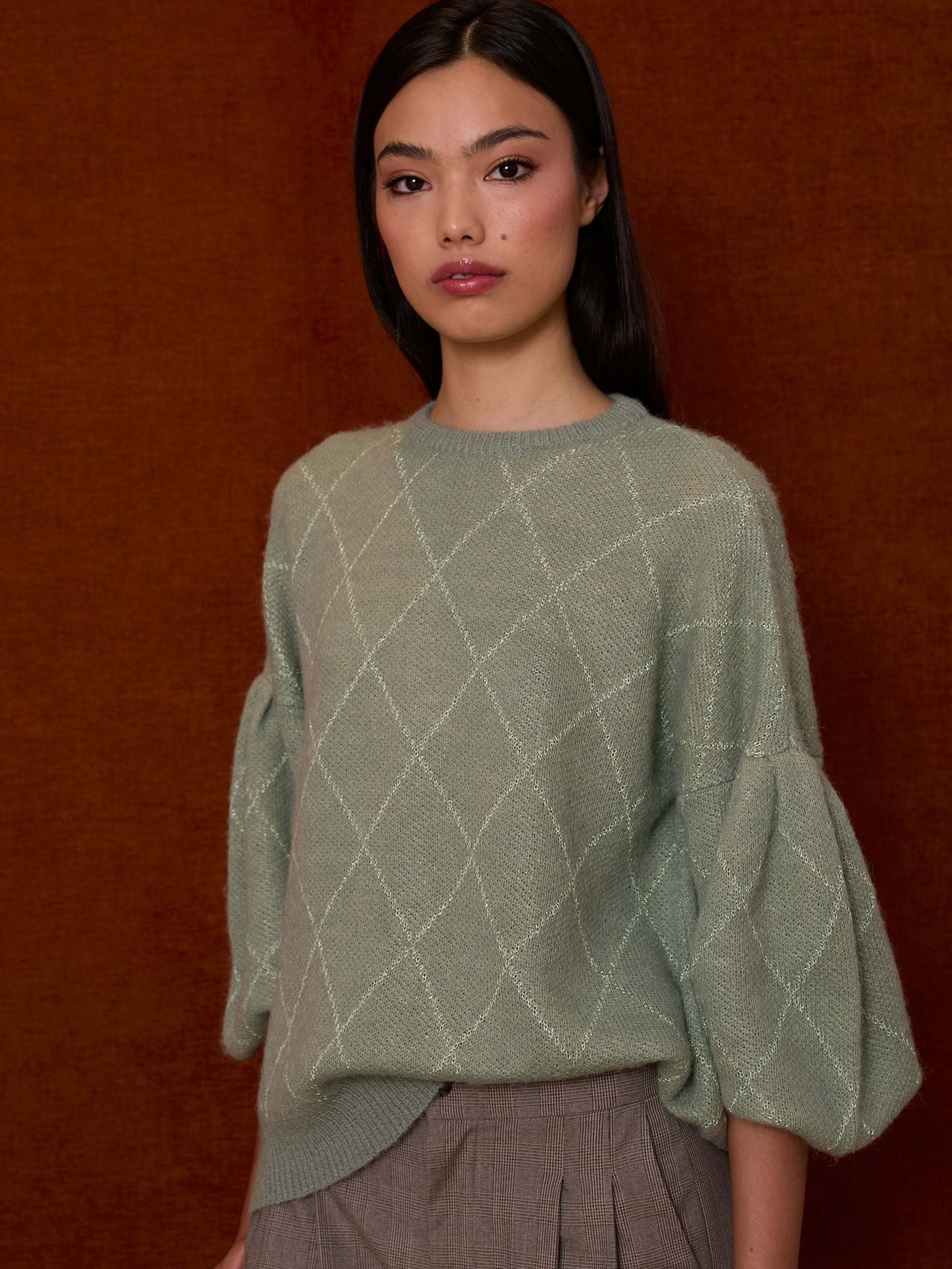 Jersey verde agua con rombos de lurex y mangas farol