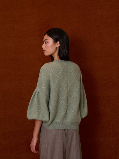 Jersey verde agua con rombos de lurex y mangas farol