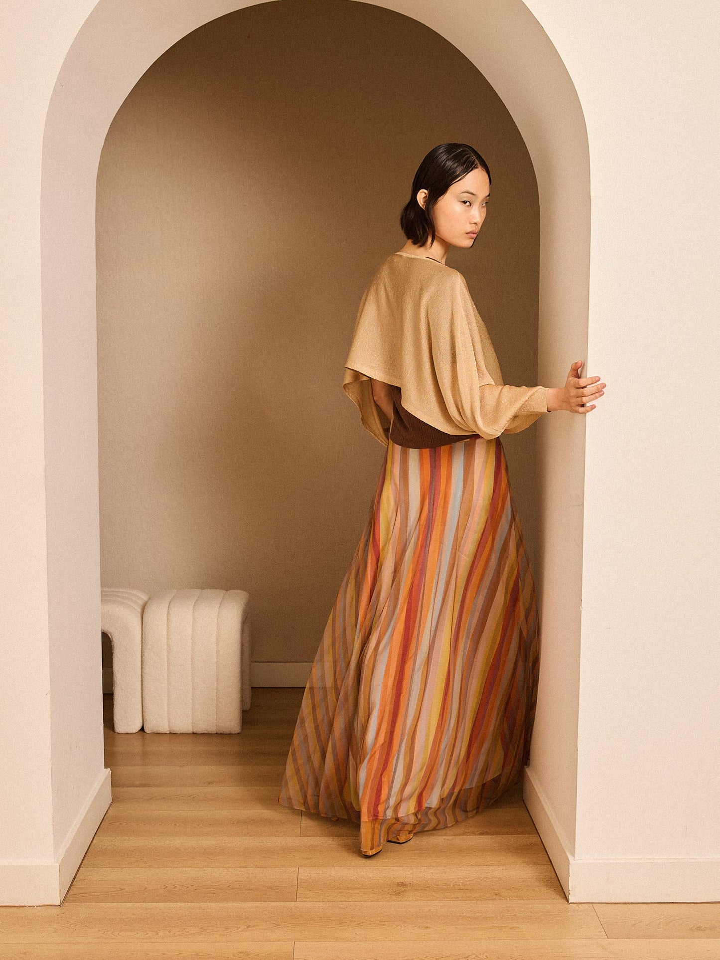 Poncho de lurex dorado