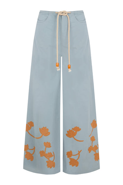 Pantalón azul con flores ocre