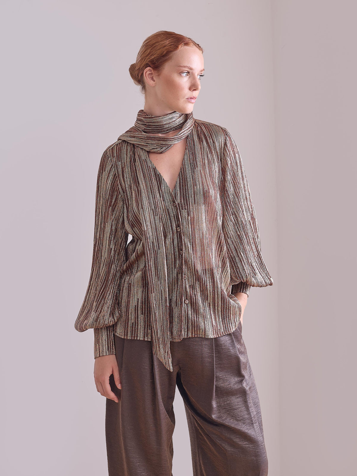 Blusa metalizada marrón