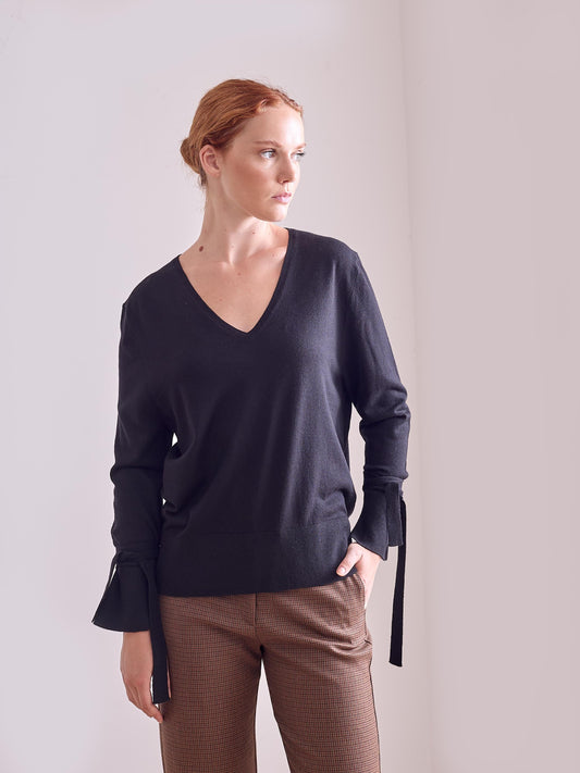 Jersey pico con lazadas negro